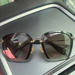 Miu Miu Black and Gold Sunglasses